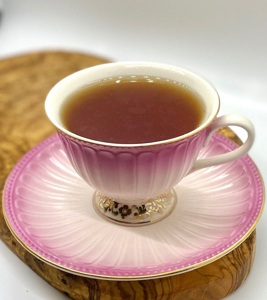 A cup of hot lavender peach black tea